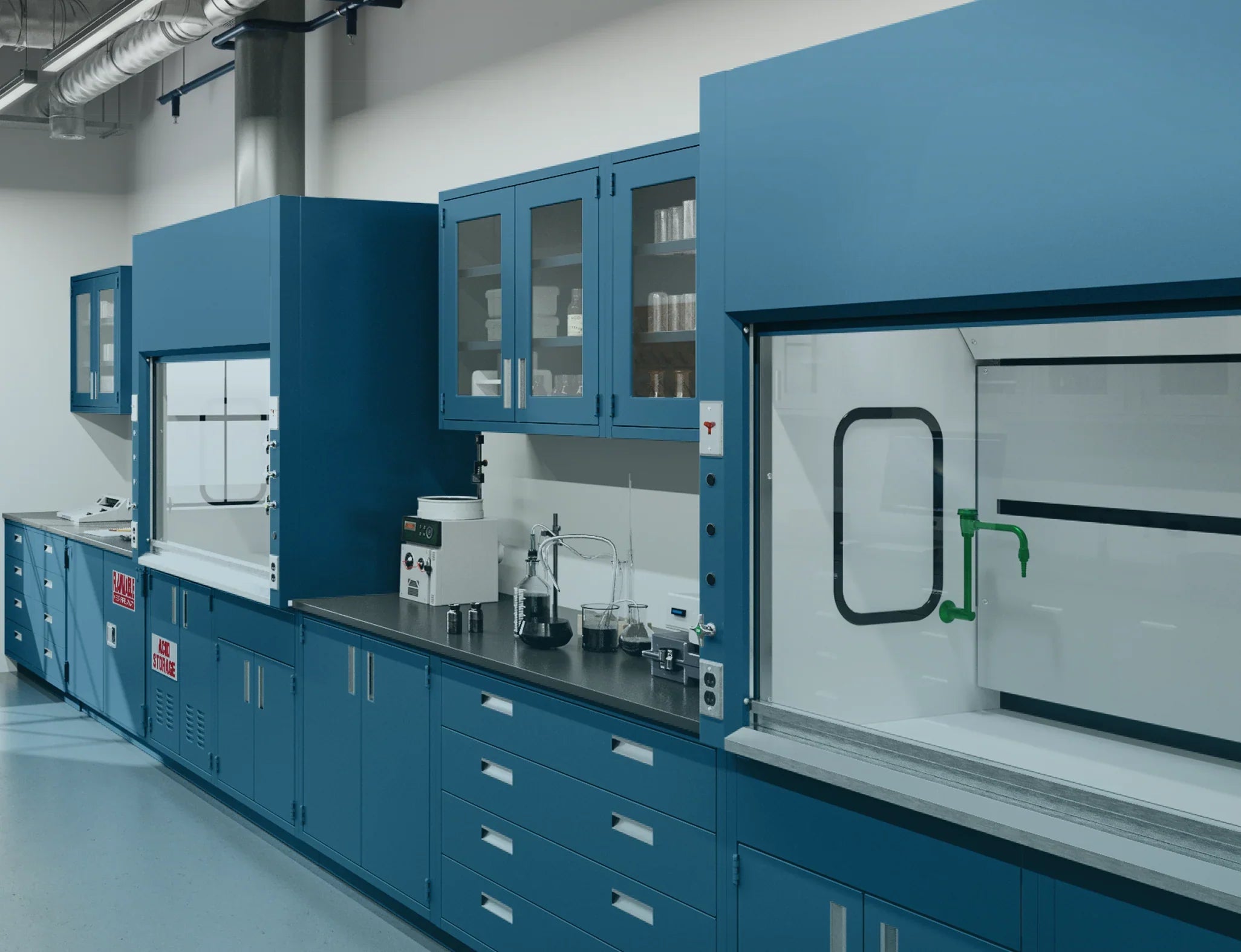 Blue laboratory fume hoods installed along a lab wall with base cabinets and adjacent work surfaces.